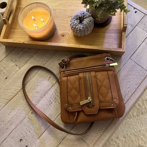 Brown purse with gold accents/zippers